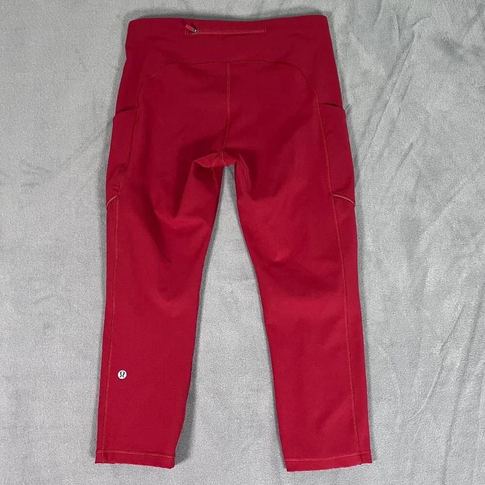 Lululemon Speed Up Tight 21" Crop Size 2 Sport Red zippered pockets reflective